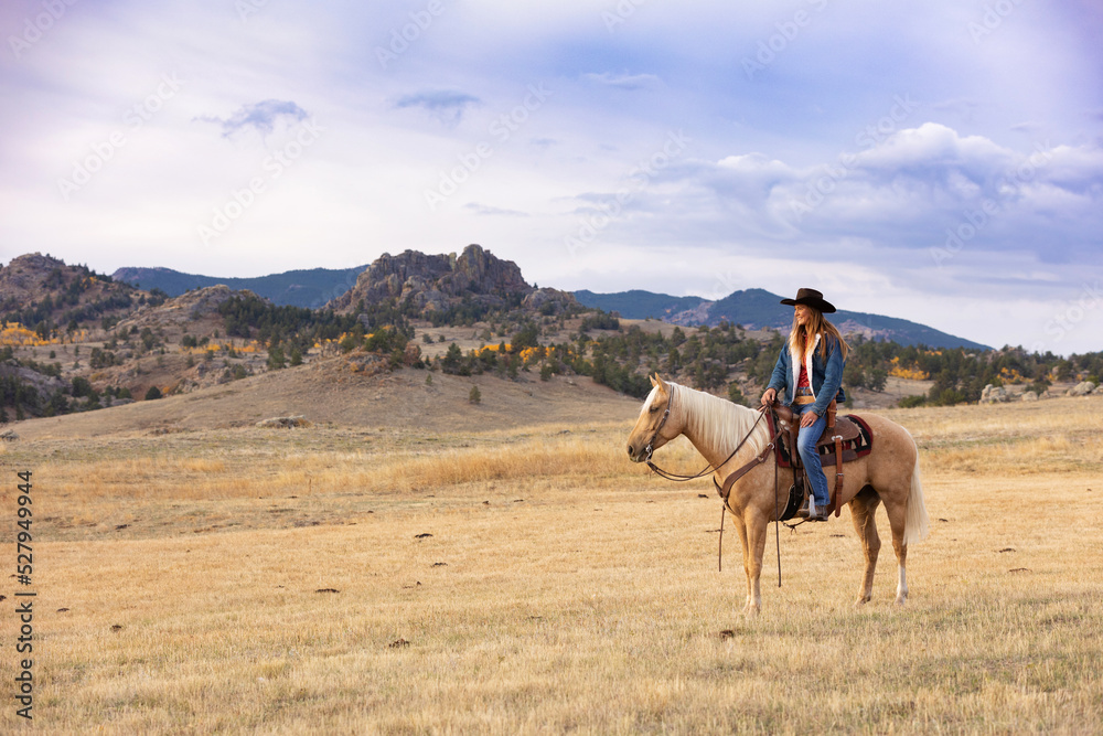 Naklejka premium Wyoming Cowgirl at Work in the Fall