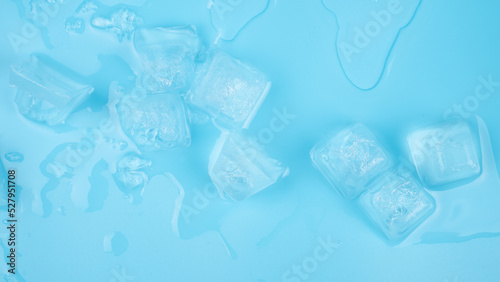 transparent cold fresh ice cubes on blue background
