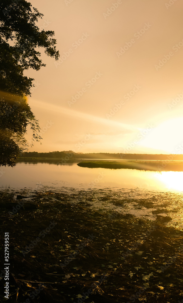 A beautiful sunset on a lake from village