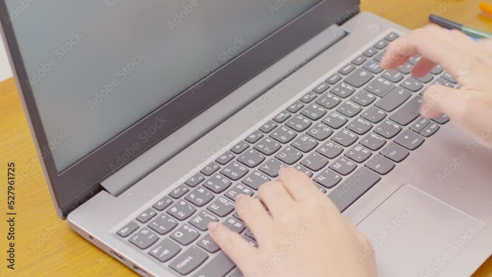 Close up hand of business woman typing on keyboard working with computer laptop. Hands of woman chatting or writing article on work table at home. B roll typing to communication on computer Close up hand of business woman typing on keyboard working with computer laptop. Hands of woman chatting or writing article on work table at home. B roll typing to communication on computer