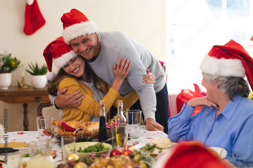 Caucasian couple sitting at table for dinner together Caucasian couple sitting at table for dinner together