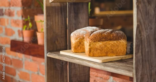 Animation of bread loafs on shelves in schop photo