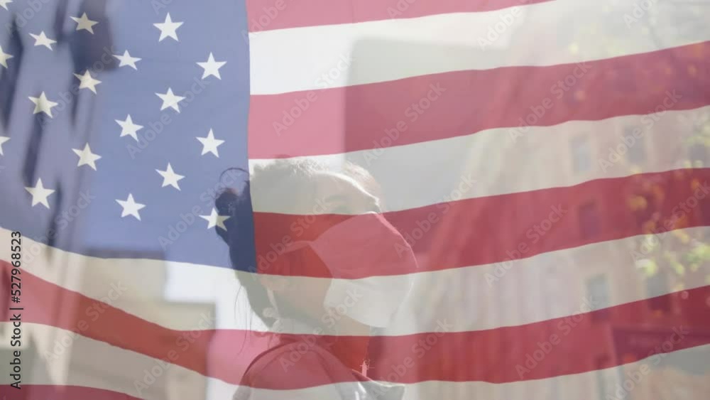 Animation of flag of usa waving over african american woman wearing face mask in city street Animation of flag of usa waving over african american woman wearing face mask in city street
