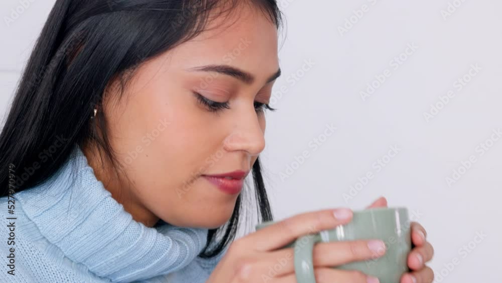 Young indian woman drinking coffee, tea and happy break at home for comfort, relax and carefree rest. Smile, beautiful and female person face sipping on warm joy, fresh cup and cozy hot mug beverage Young indian woman drinking coffee, tea and happy break at home for comfort, relax and carefree rest. Smile, beautiful and female person face sipping on warm joy, fresh cup and cozy hot mug beverage