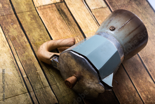 Mocha port coffee maker on wooden floor high resolution photography