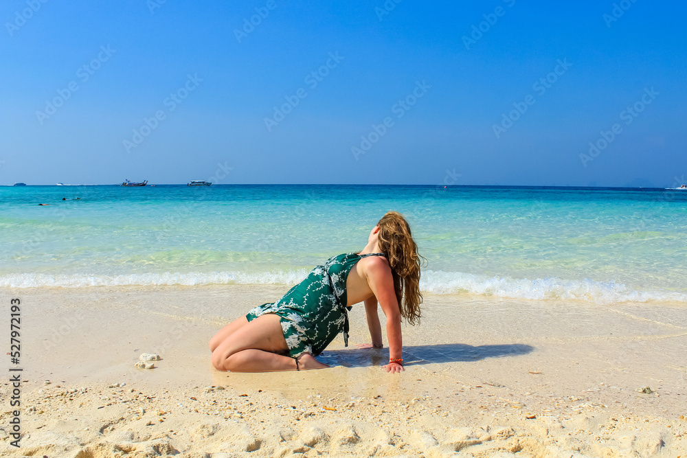 Woman on the beach enjoying beautiul scenery with turqoise waters and white sand, Koh Similan, Phuket, Thailand Woman on the beach enjoying beautiul scenery with turqoise waters and white sand, Koh Similan, Phuket, Thailand