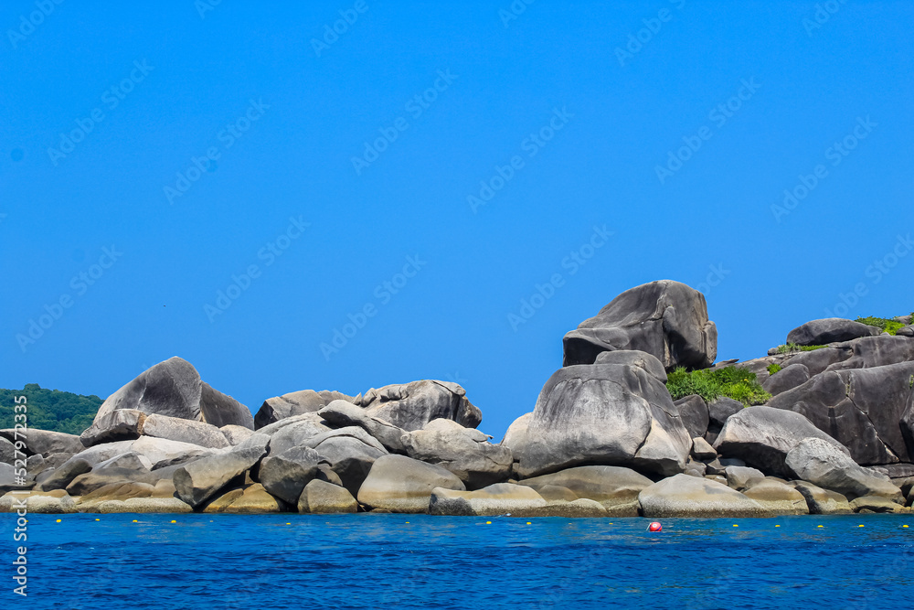 Fototapeta premium Granite rocks on the 9th island of Similan islands, Phuket, Thailand, blue sky, copy space for text, wallpaper