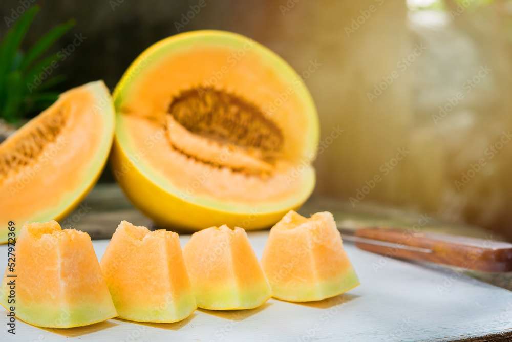 sliced of melons, fresh Melon or cantaloupe, Cantaloupe melons on wood background, Favorite fruit in summer