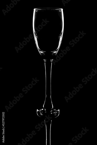 Empty wine glass on a black background © Rattanapon