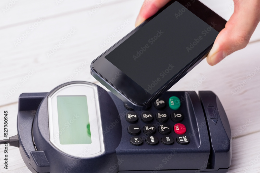 Man using smartphone to express pay Man using smartphone to express pay