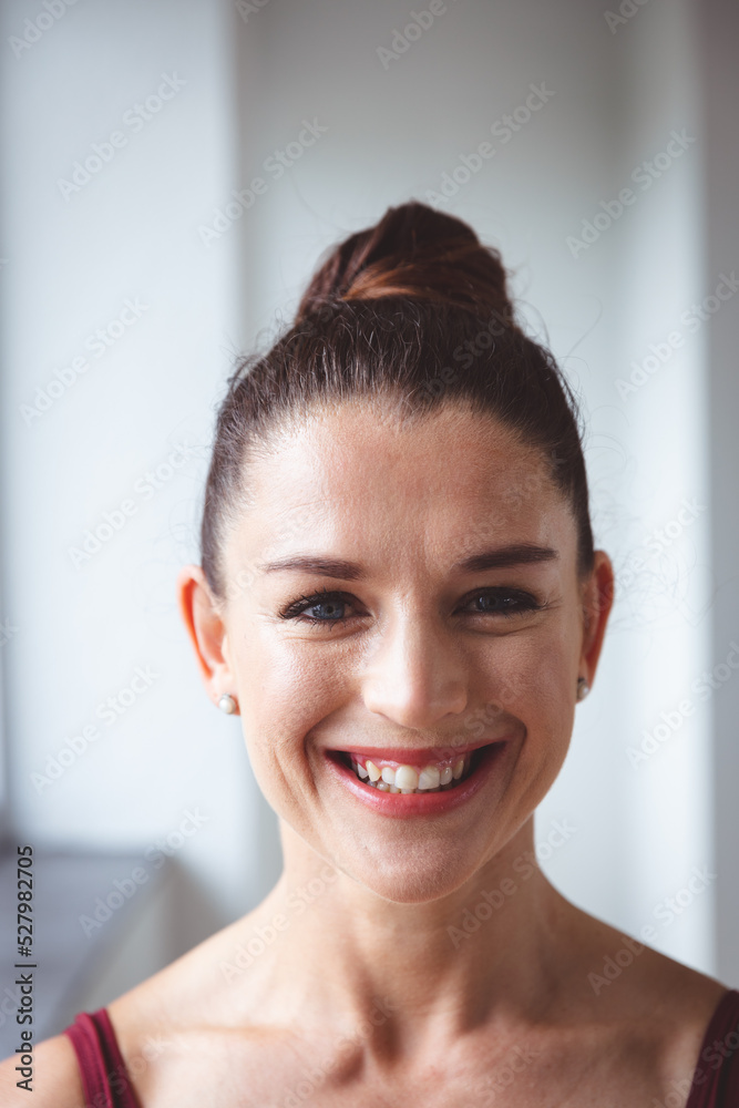 Caucasian female ballet dancer staring into the camera with a serious face Caucasian female ballet dancer staring into the camera with a serious face