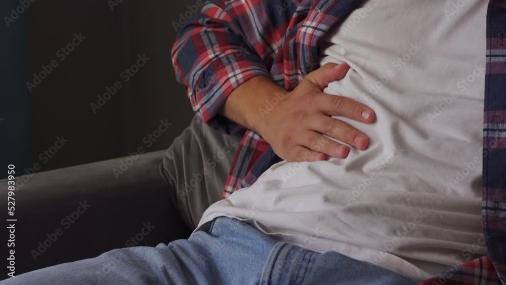 Pain in the side. Man suffers from liver pain Pain in the side. Man suffers from liver pain