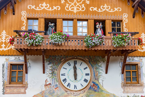 this house wall is a clock cuckoo clock from the Black Forest