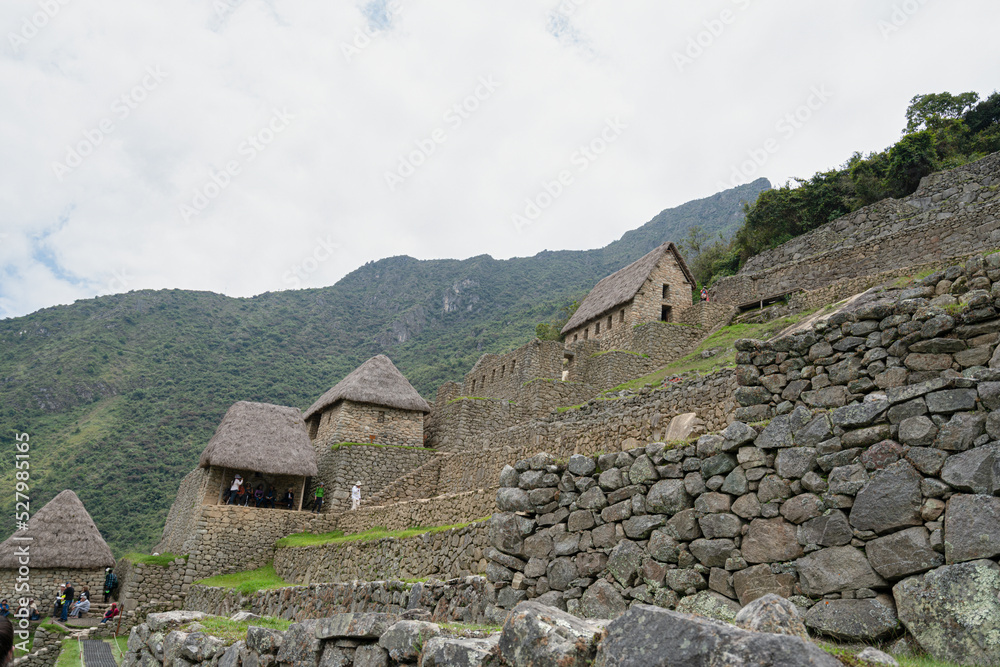 Machu picchu, pre columbian inca site situated on a mountain ridge above the urubamba valley in Peru.
