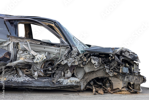 A close-up isolate on the side of the front of a black car, smashed into wreckage, cannot be repaired and reused due to a collision with another vehicle, causing severe damage.