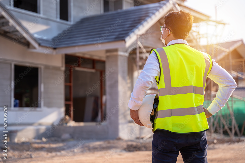 Architect or Building inspector. Engineer at Construction site check drawing and business workflow of new building. Building and housing project. construction concept. Architect or Building inspector. Engineer at Construction site check drawing and business workflow of new building. Building and housing project. construction concept.