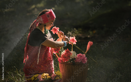 Beautiful Asian young tribal lady in the native traditional dress culture of Karen people minority ethnic culture. Portraits of identity dress folk applying fashion concepts. photo