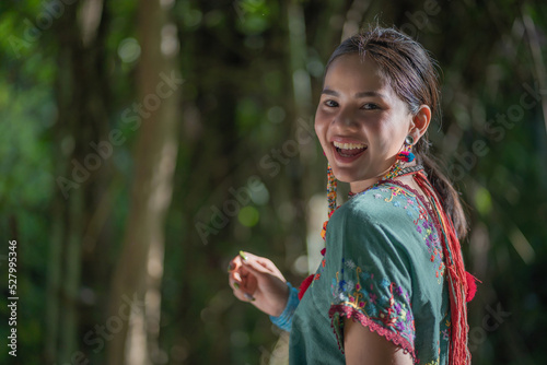 Beautiful Asian young tribal lady in the native traditional dress culture of Karen people minority ethnic culture. Portraits of identity dress folk applying fashion concepts.