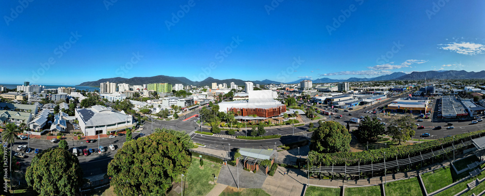 Aerial panorama of park and cityscape with mountains and perfect blue sky