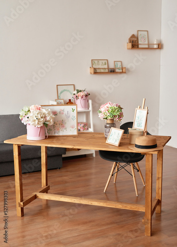 Pink living room and kitchen. Studio apartment. Loft interior. Shelves and spring decor in room. Rent and delivery of housing. Hostel and hotel