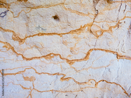 Smooth surface of layered sandstone sediment rock.  Colorful sandstone