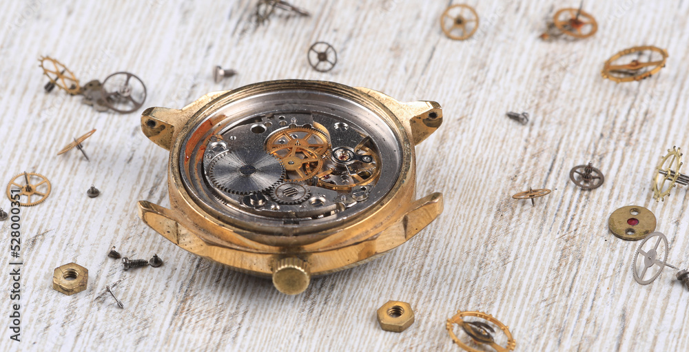 watch repair on wooden table
