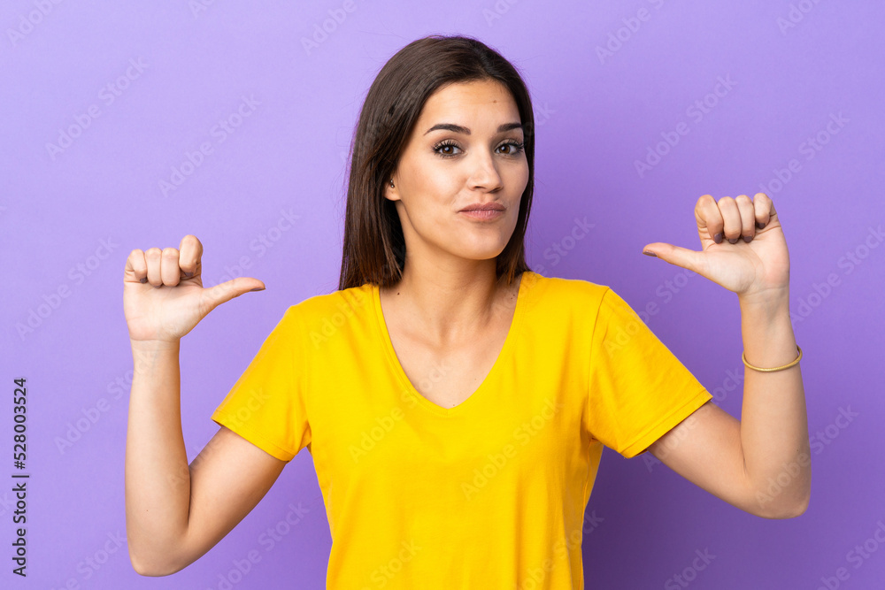Young caucasian woman over isolated background proud and self-satisfied Young caucasian woman over isolated background proud and self-satisfied