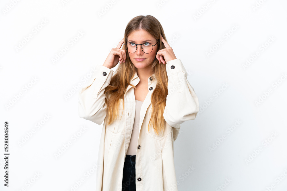 Young blonde woman isolated on white background having doubts and thinking Young blonde woman isolated on white background having doubts and thinking