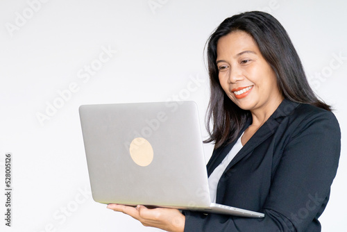 Working Business Woman in Black Suit Jacket Holding Labtop Computer