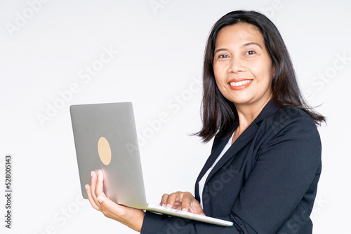 Working Business Woman in Black Suit Jacket Holding Labtop Computer