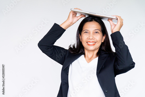 Working Business Woman in Black Suit Jacket Holding Labtop Computer