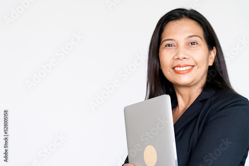 Working Business Woman in Black Suit Jacket Holding Labtop Computer