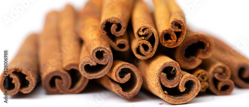 Cinnamon sticks on white background isolated. Indian spices close up. Medicinal herbs and spices.