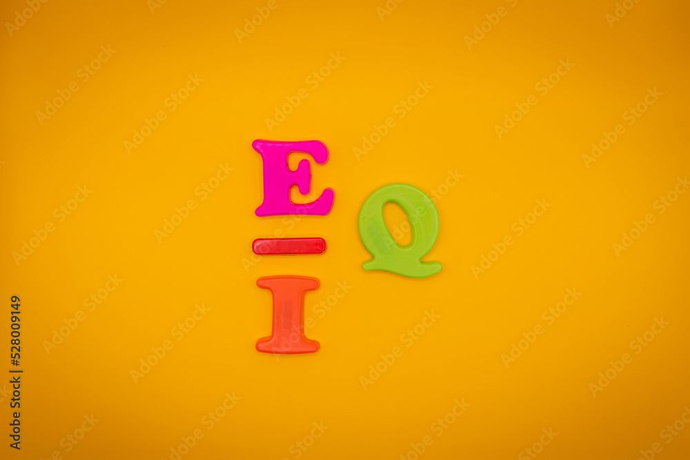 IQ or EQ symbol. Intelligence quotient to EQ, emotional quotient on yellow background. Emotional and intelligence quotient concept IQ or EQ symbol. Intelligence quotient to EQ, emotional quotient on yellow background. Emotional and intelligence quotient concept