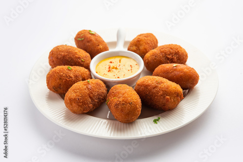 Photography Macher Chop - Bengali style fish cutlet or pakora, a popular festival snack from