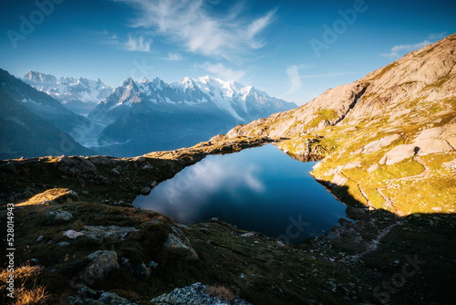 Fantastic scene of high alpine lake Lac Blanc and Mont Blanc glacier. Chamonix resort, Graian Alps, France, Europe.