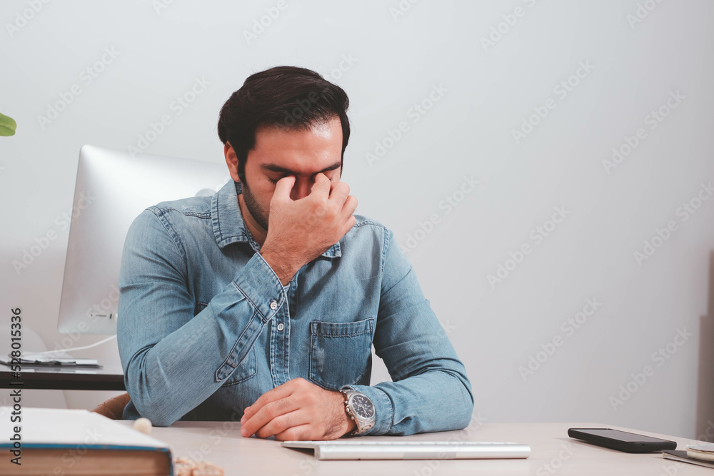 Naklejka premium Confident Businessman executive commuter is looking at hand held digital tablet screen. Confident professional making successful plan while working on laptop at office.