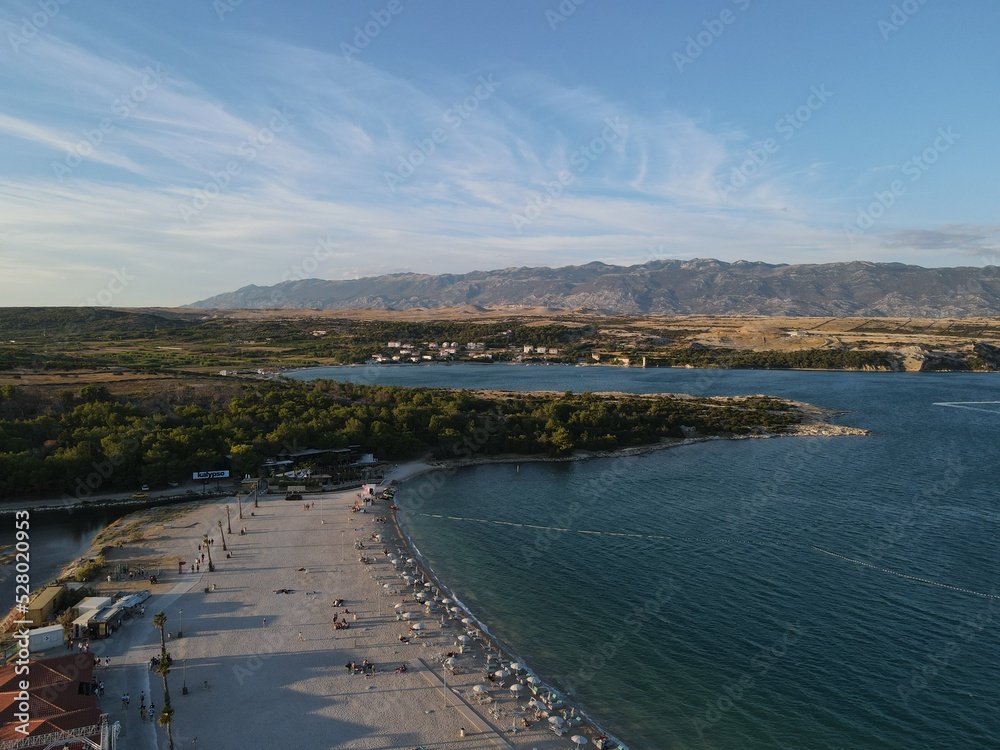 Aerial view of Zrce Beach Festival in Novalja, island Pag, archipelago of Croatia. People partying on a hot summer day on Zrce beach. Zrce beach is the most popular party destination on Adriatic sea.