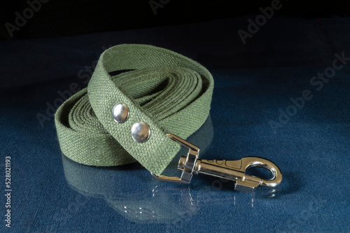 Canvas dog leash on a glass table