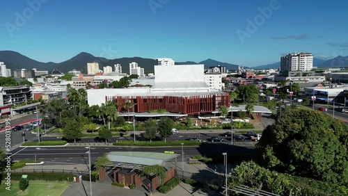 Aerial video of preforming arts centre and park, drone flying backwards and up