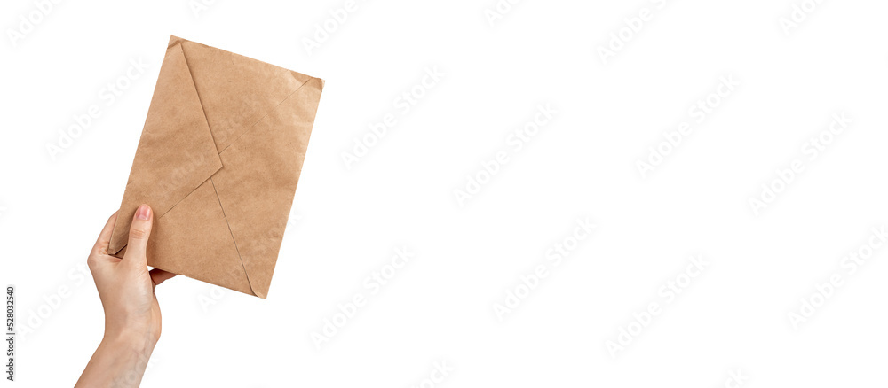 Banner with hand holding kraft paper envelope isolated on white background. Eco-friendly package for letter, invitation, postcard. Copy space Banner with hand holding kraft paper envelope isolated on white background. Eco-friendly package for letter, invitation, postcard. Copy space