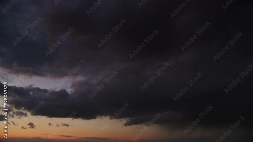 Blizzard storm sky on a sunset wi cumulus clouds and a pouring summer rain in slow motion Blizzard storm sky on a sunset wi cumulus clouds and a pouring summer rain in slow motion