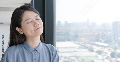woman sitting by the window Free Download woman sitting by the window - GFXLoad