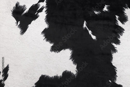 black and white fur of cow texture carpet background for pattern banner