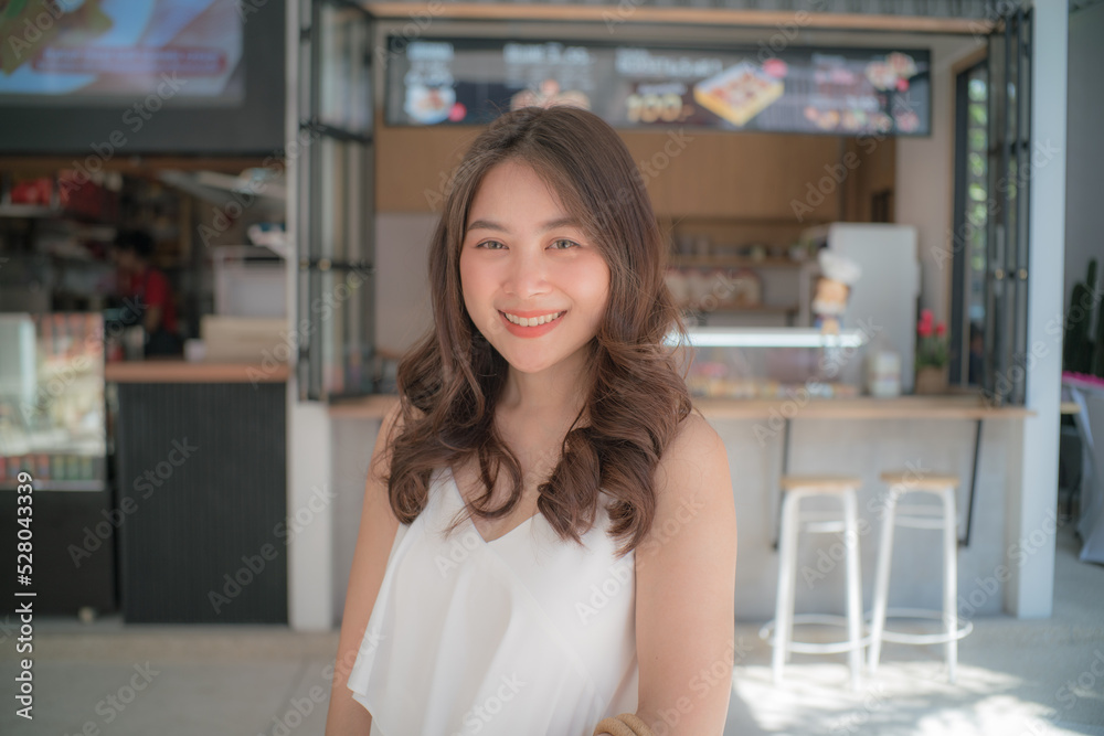 Pretty asian woman posting in coffee shop city travel Pretty asian woman posting in coffee shop city travel