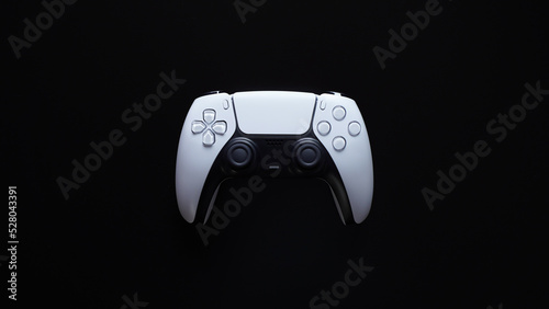 Modern white gamepad isolated on a black background