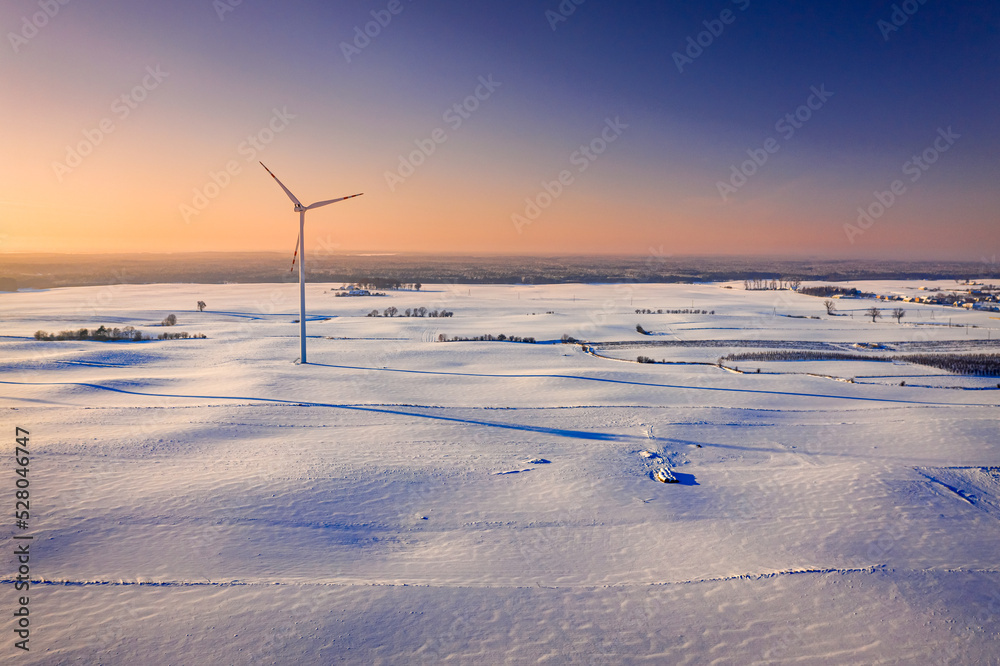 Wind turbines on snowy field. Alternative energy in winter, Poland. Wind turbines on snowy field. Alternative energy in winter, Poland.