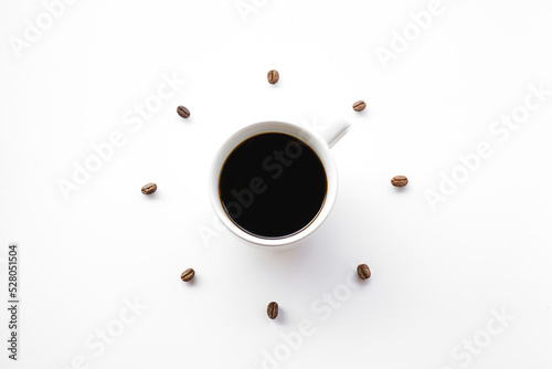 Black hot coffee cup on white background with Coffee beans arrange as forming clock face