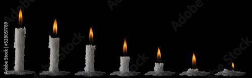 time lapse of burning wax candles isolated on black background, collection