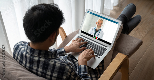 Doctor video call online by modish telemedicine software application for virtual meeting with patient photo